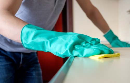 Professional upholstery cleaning tools for a sofa in Stockwell
